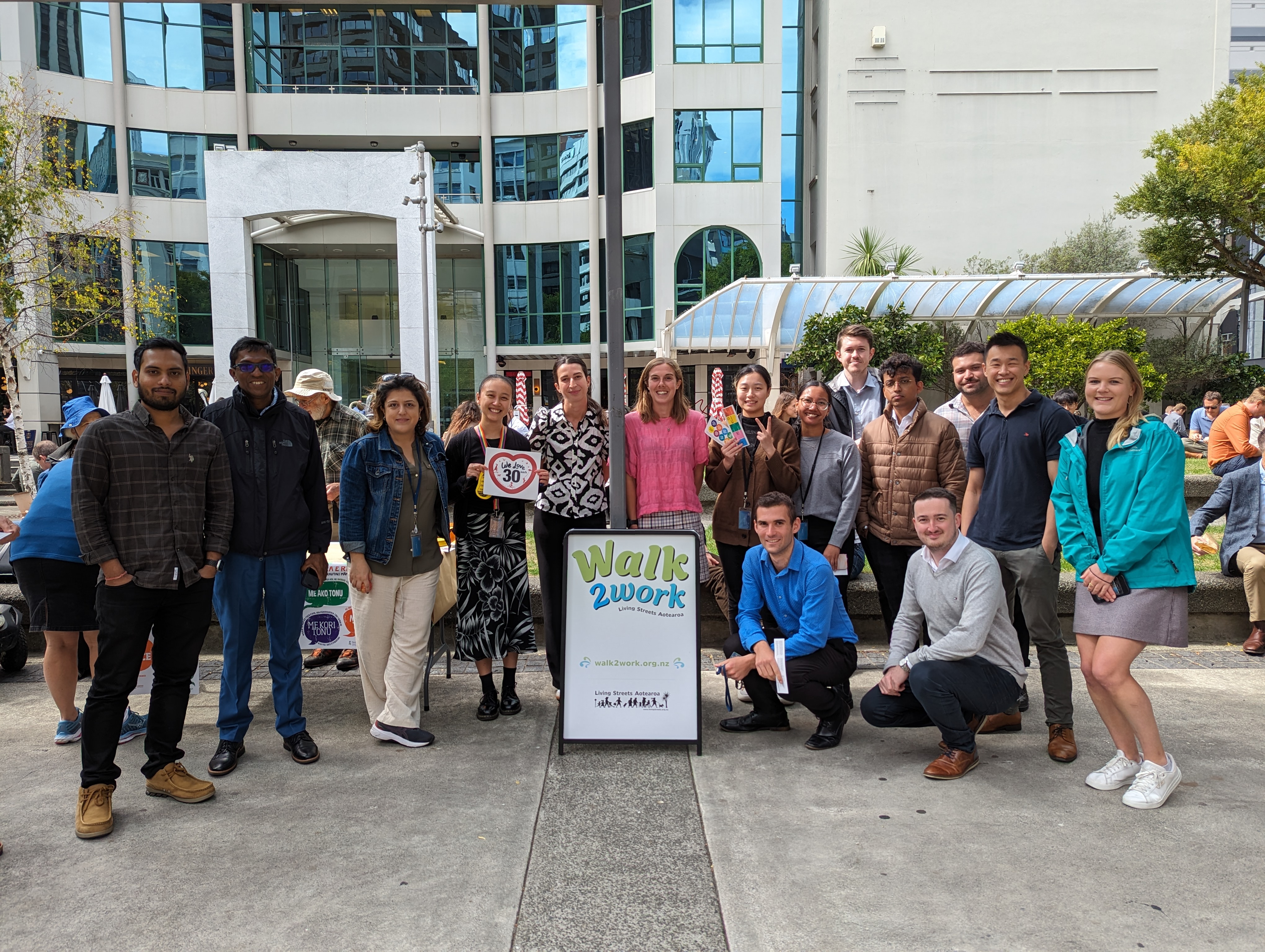 A large group of people with the Walk2Work Day sign in Midland Park, Wellington
