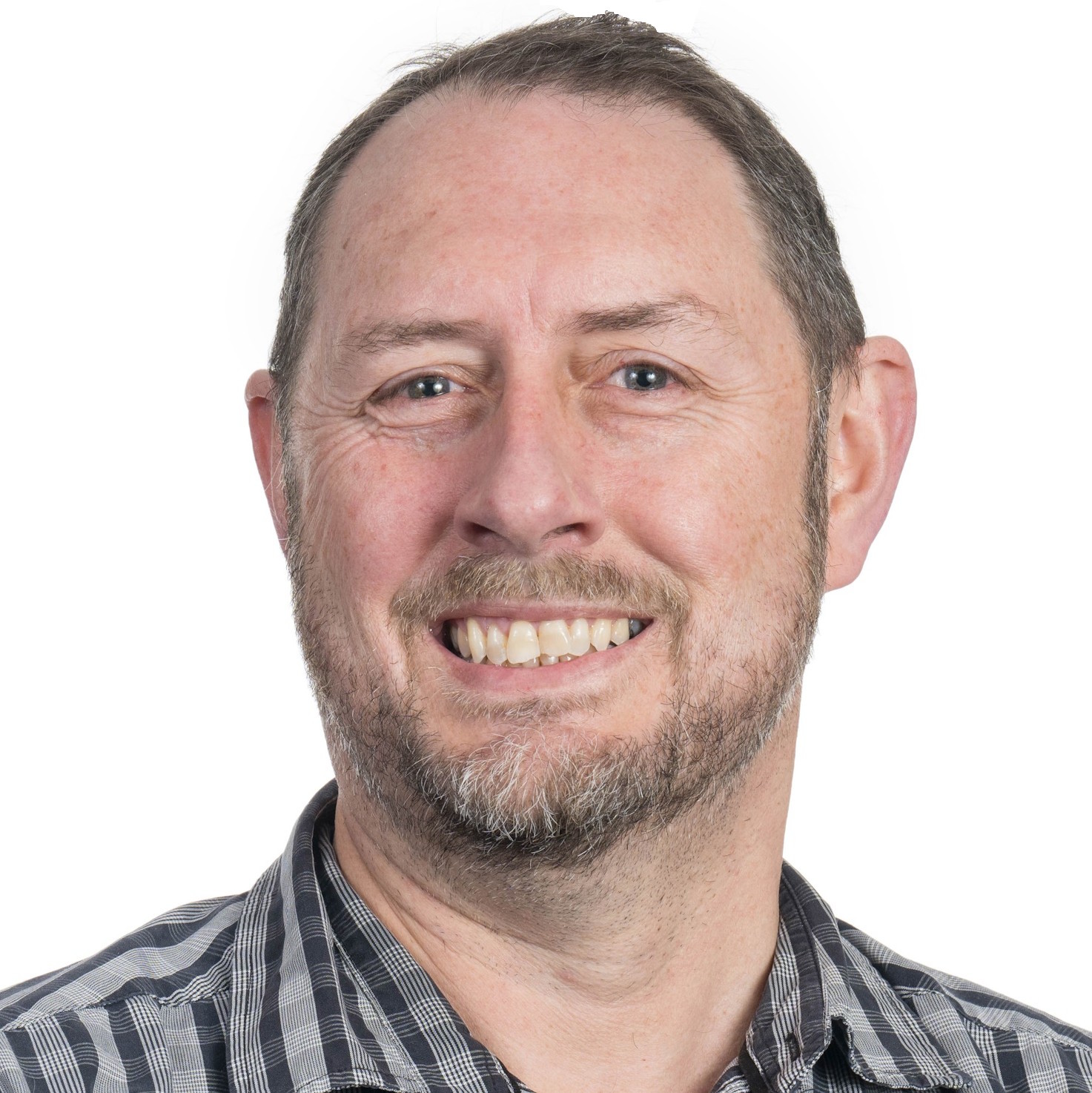 A headshot of Glen Koorey with brown hair and brown eyes, a beard, and a checked shirt. 